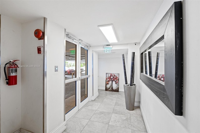 hallway with light tile patterned floors