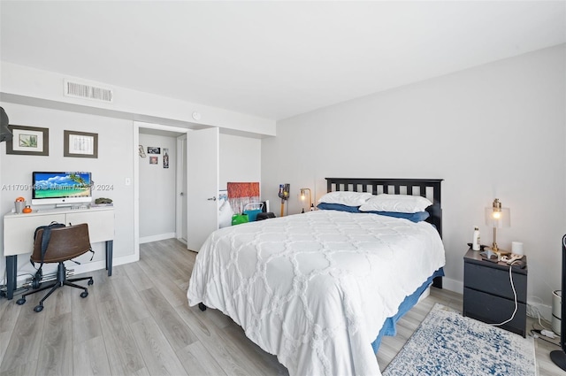 bedroom with light wood-type flooring