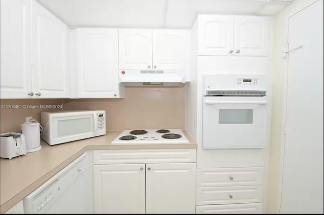 kitchen with white cabinets and white appliances