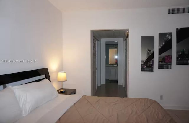 bedroom featuring hardwood / wood-style floors