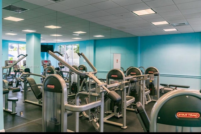 workout area with a drop ceiling