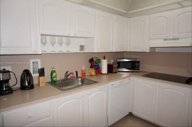 kitchen featuring white cabinets, black electric cooktop, white dishwasher, and sink