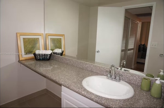 bathroom with vanity and tile patterned floors