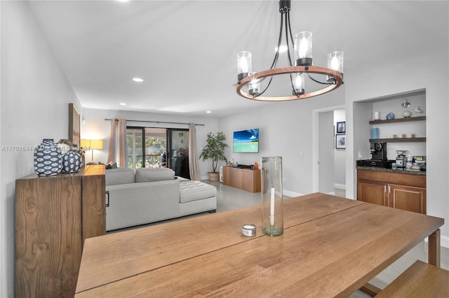 dining space featuring a notable chandelier