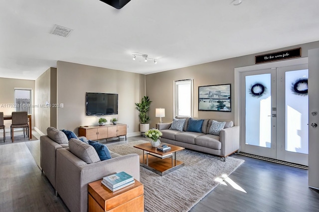 living room featuring french doors and dark hardwood / wood-style floors