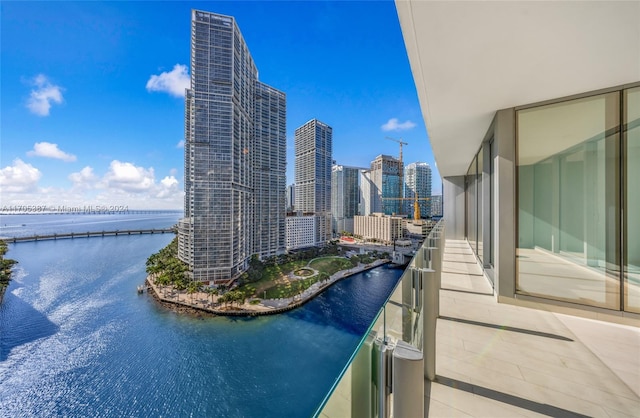 balcony featuring a water view