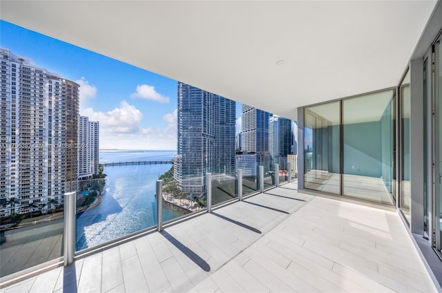 balcony featuring a water view