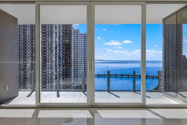 doorway to outside with a water view