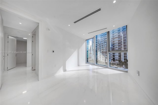 empty room featuring floor to ceiling windows