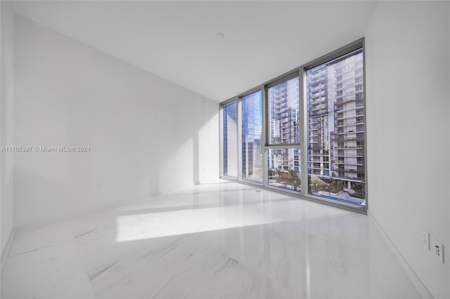 empty room featuring floor to ceiling windows