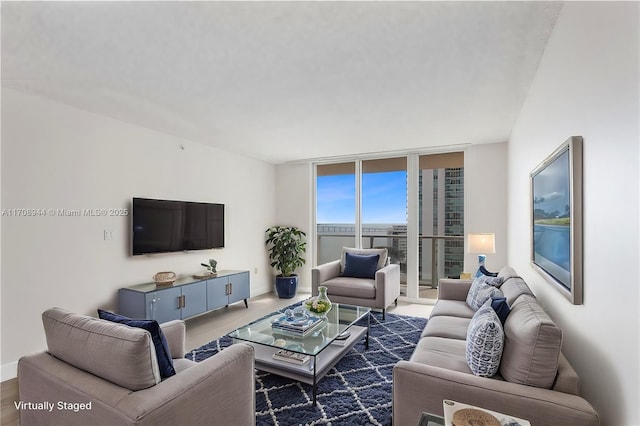 living room featuring a wall of windows