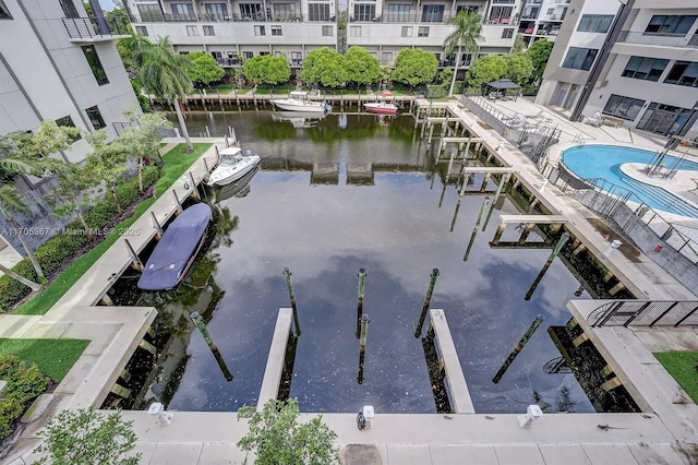 exterior space with a water view and a boat dock