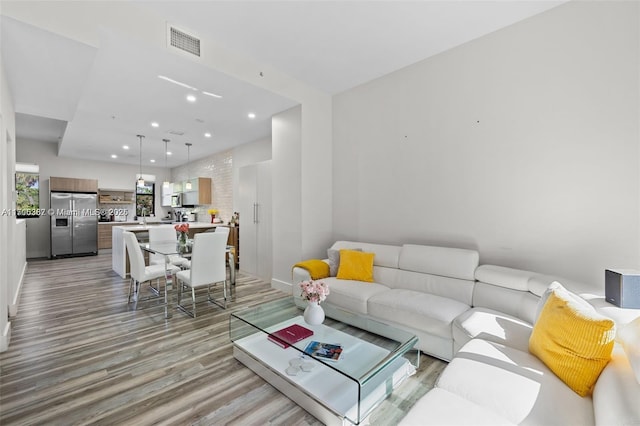 living room with light hardwood / wood-style flooring