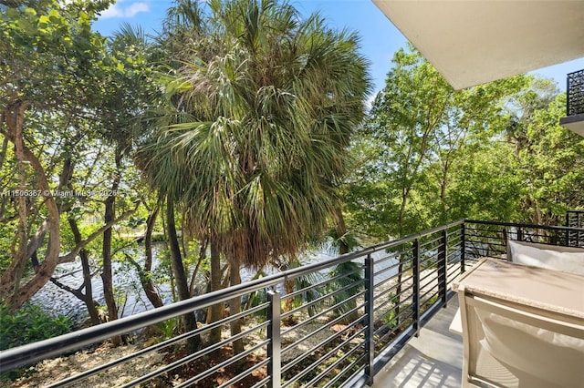 balcony featuring a water view