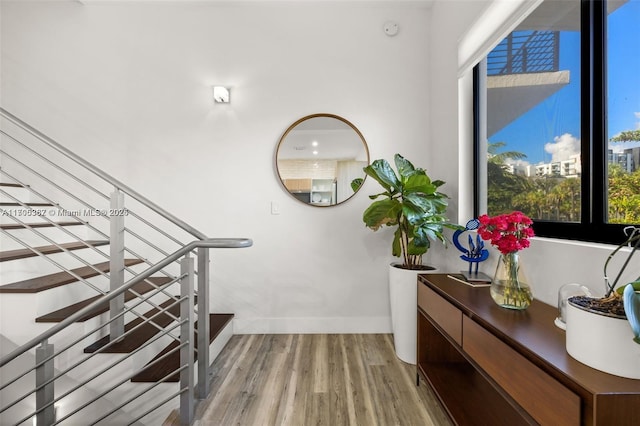 staircase featuring hardwood / wood-style flooring