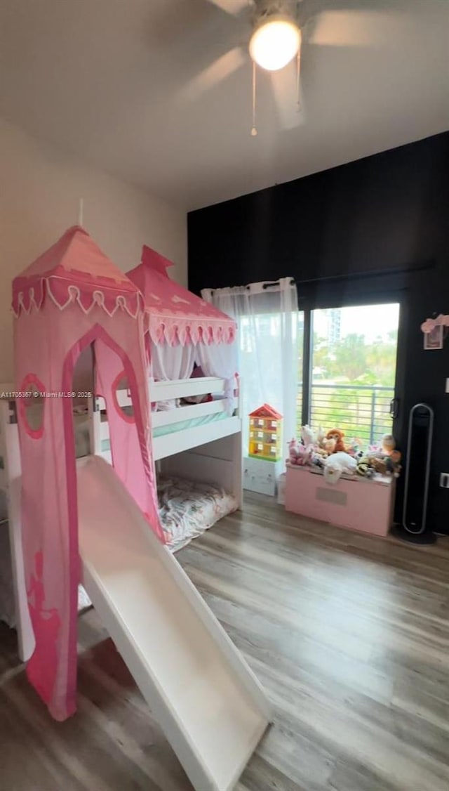 bedroom with ceiling fan and hardwood / wood-style flooring