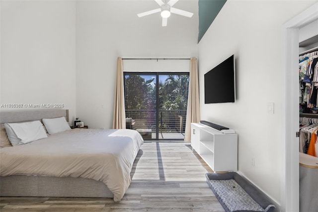 bedroom featuring access to outside, ceiling fan, and light hardwood / wood-style floors