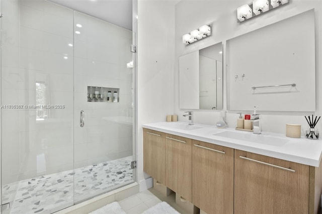 bathroom featuring tile patterned floors, walk in shower, and vanity