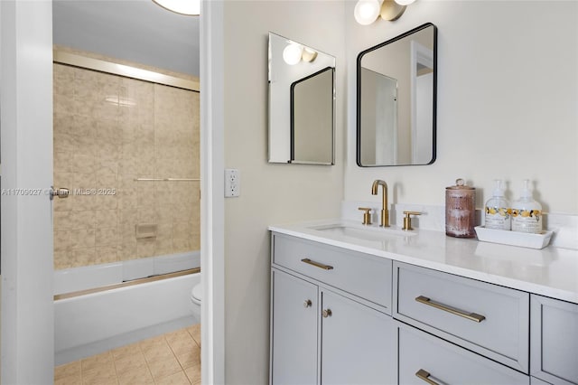 full bathroom with toilet, tile patterned floors, shower / bathtub combination, and vanity