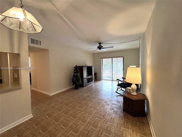 living room featuring parquet flooring and ceiling fan