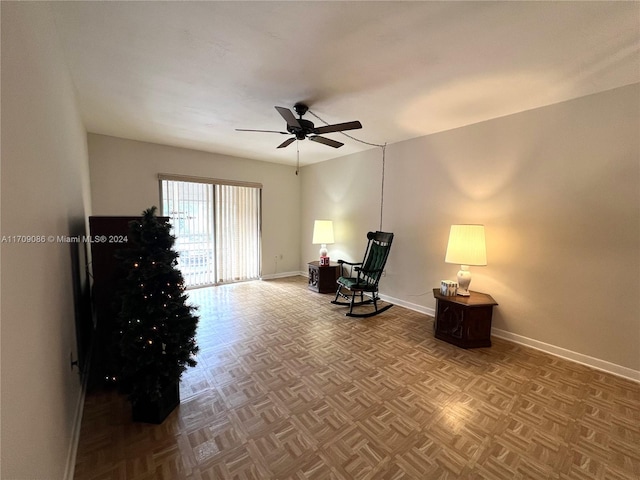 unfurnished room with ceiling fan and parquet flooring