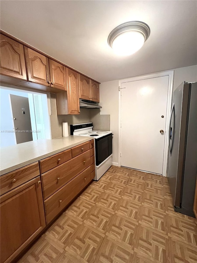 kitchen with stainless steel fridge, white electric stove, and light parquet floors