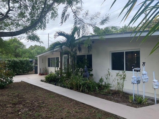 view of side of property with a patio area