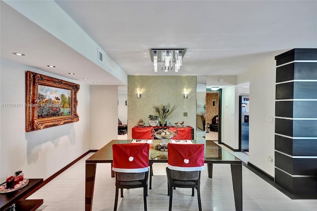 dining area featuring a notable chandelier