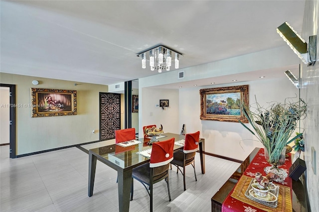 dining space with an inviting chandelier