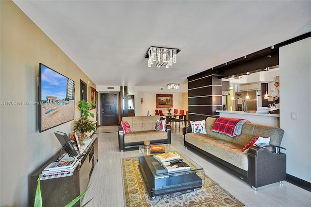 living room with a notable chandelier