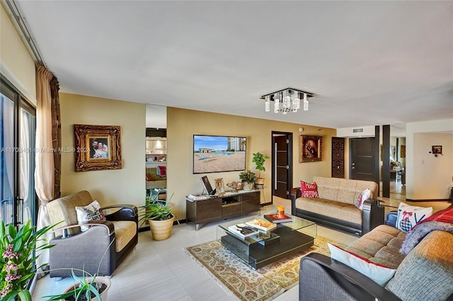 living room with a notable chandelier