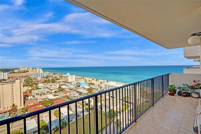 balcony with a beach view and a water view