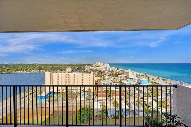 balcony with a beach view and a water view