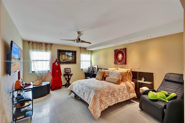 bedroom featuring ceiling fan and multiple windows