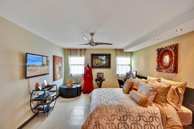 bedroom featuring ceiling fan and multiple windows