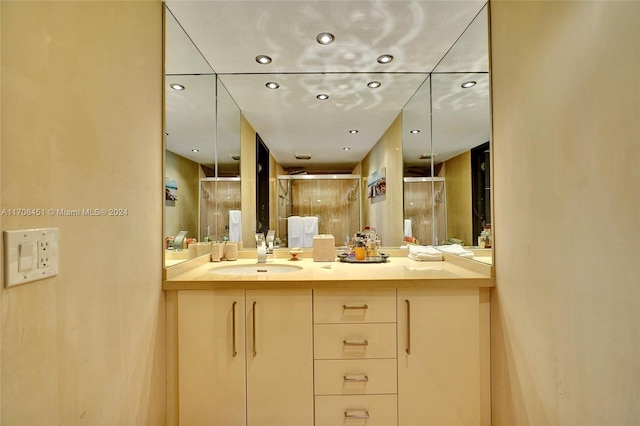 bathroom with vanity and an enclosed shower