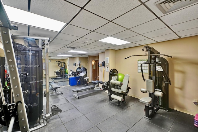 exercise room with a drop ceiling