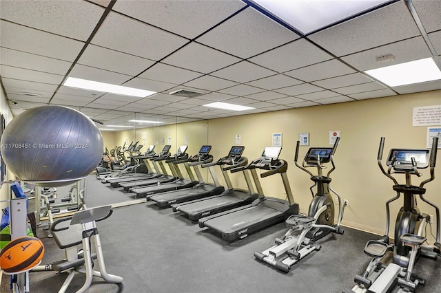 workout area with a drop ceiling