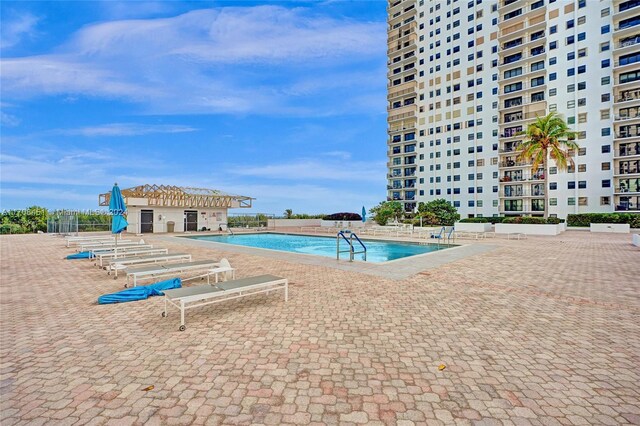 view of swimming pool featuring a patio area