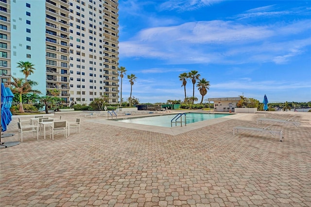 view of swimming pool with a patio