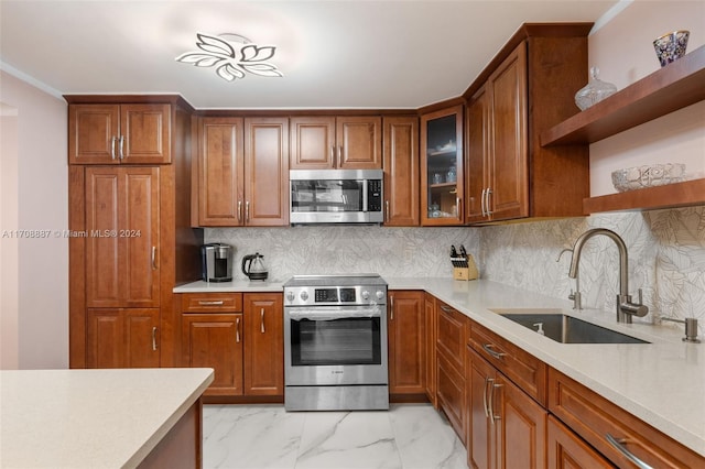 kitchen with backsplash, stainless steel appliances, and sink