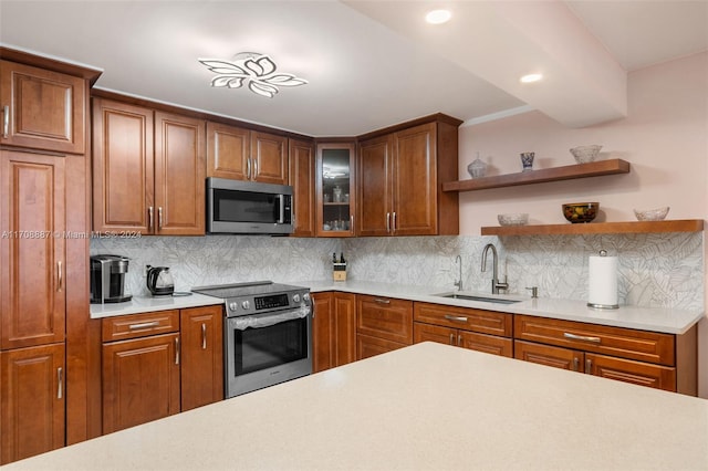 kitchen featuring backsplash, sink, and stainless steel appliances