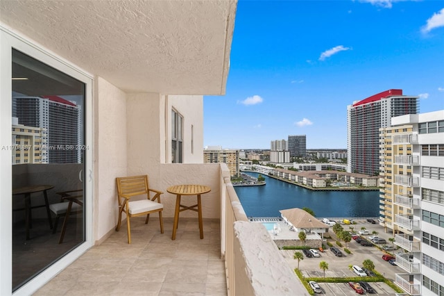 balcony featuring a water view