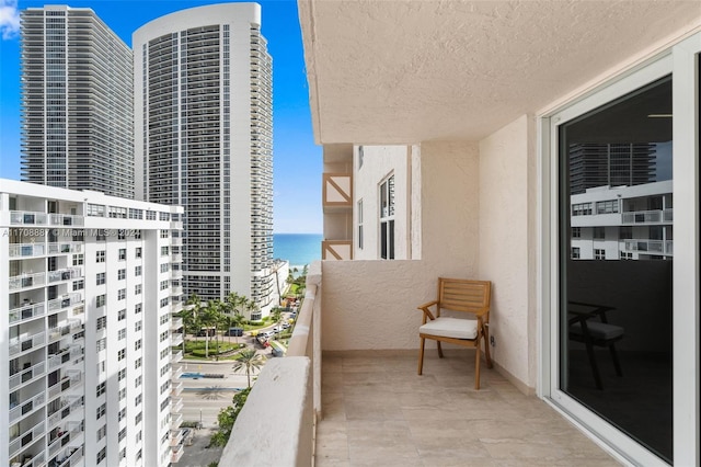 balcony featuring a water view