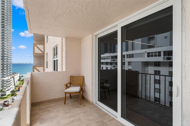 balcony featuring a water view