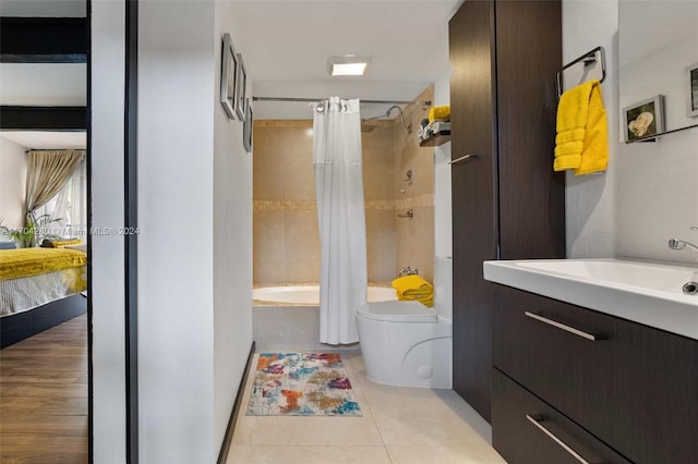 full bathroom featuring tile patterned flooring, vanity, toilet, and shower / bathtub combination with curtain