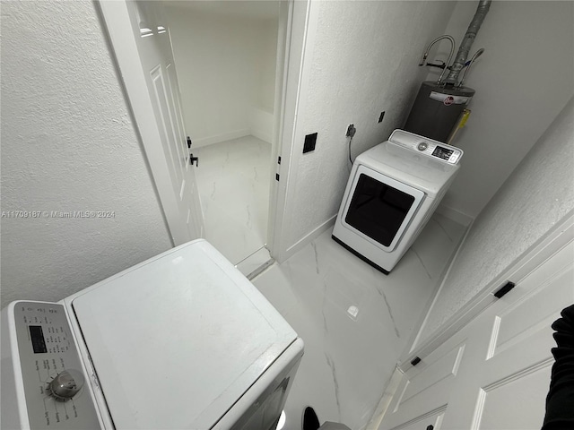 washroom featuring washer / clothes dryer and water heater