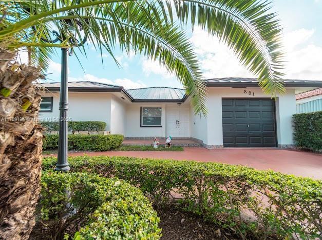 view of front of property with a garage