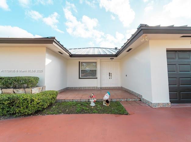 entrance to property with a garage