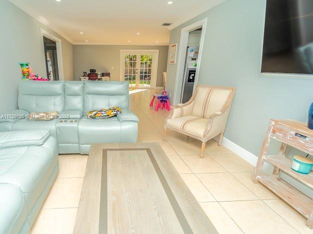 tiled living room with french doors